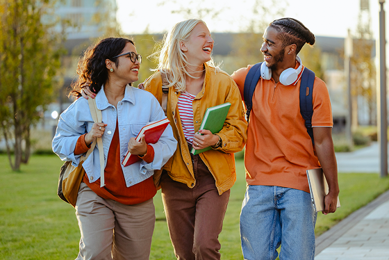 Three student walking on a college campus